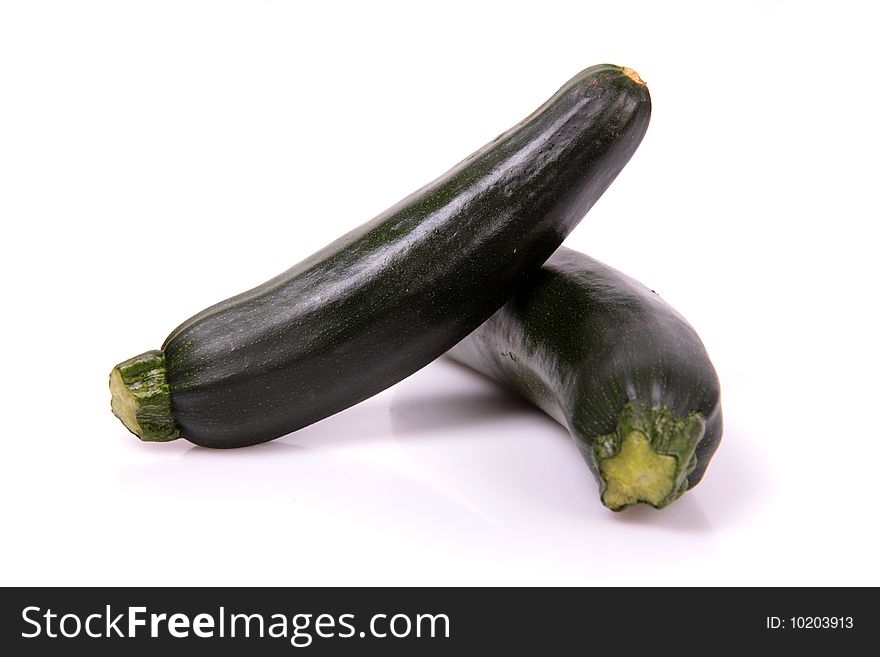 Two fresh marrows on a white background. Two fresh marrows on a white background.