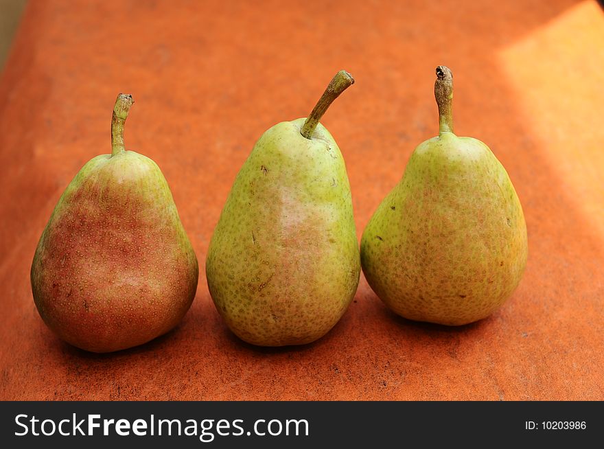 Three happy pears in line