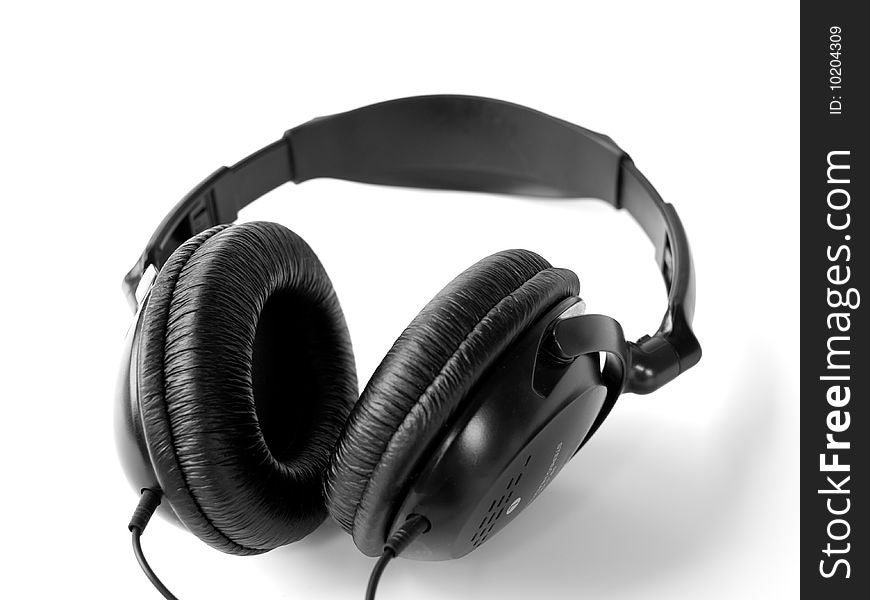 Headphones on white background with shadows. Shallow DOF. Headphones on white background with shadows. Shallow DOF.