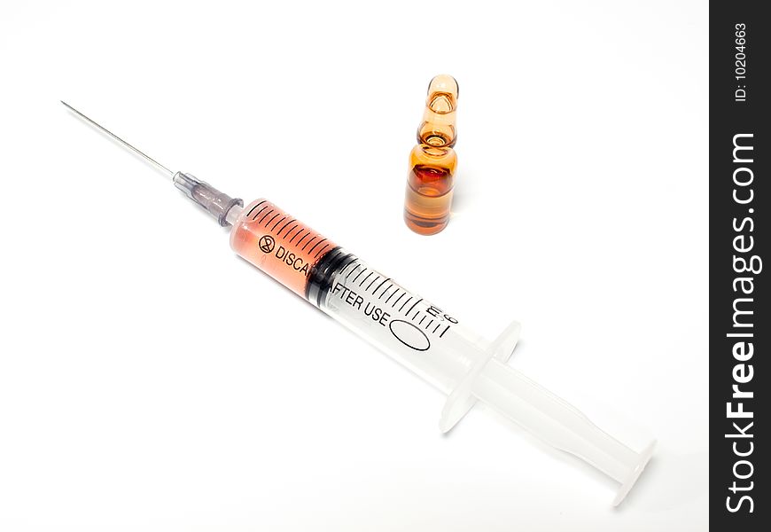 Filled syringe and drug ampula on white background. Filled syringe and drug ampula on white background.
