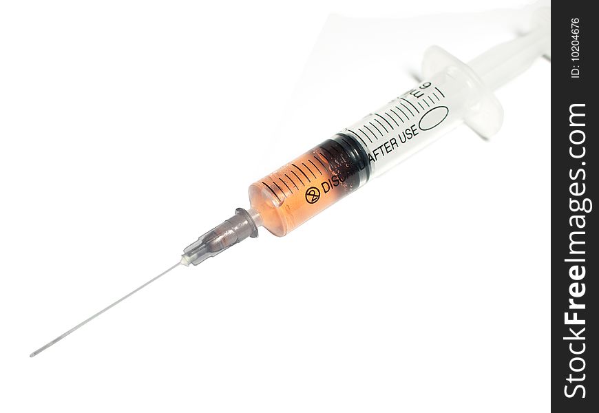 Filled syringe on white background. Filled syringe on white background.