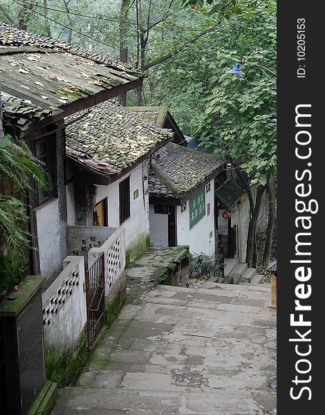 Folk house in ChongQing,China. The roof covered with green moss. Look every thing is moist.