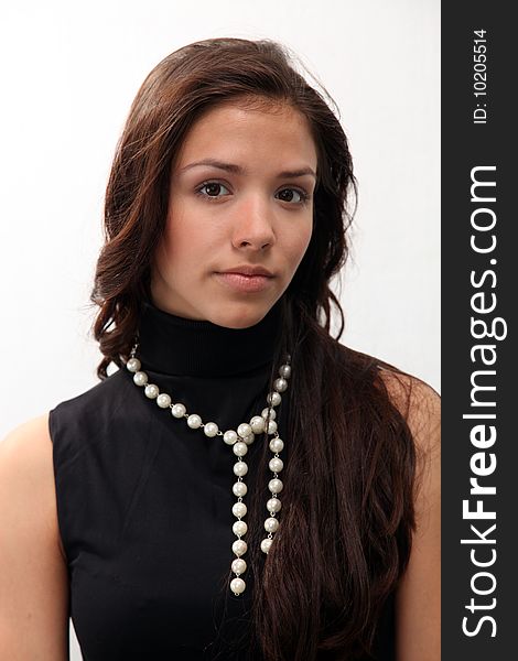 Portrait of young charming girl on a white background