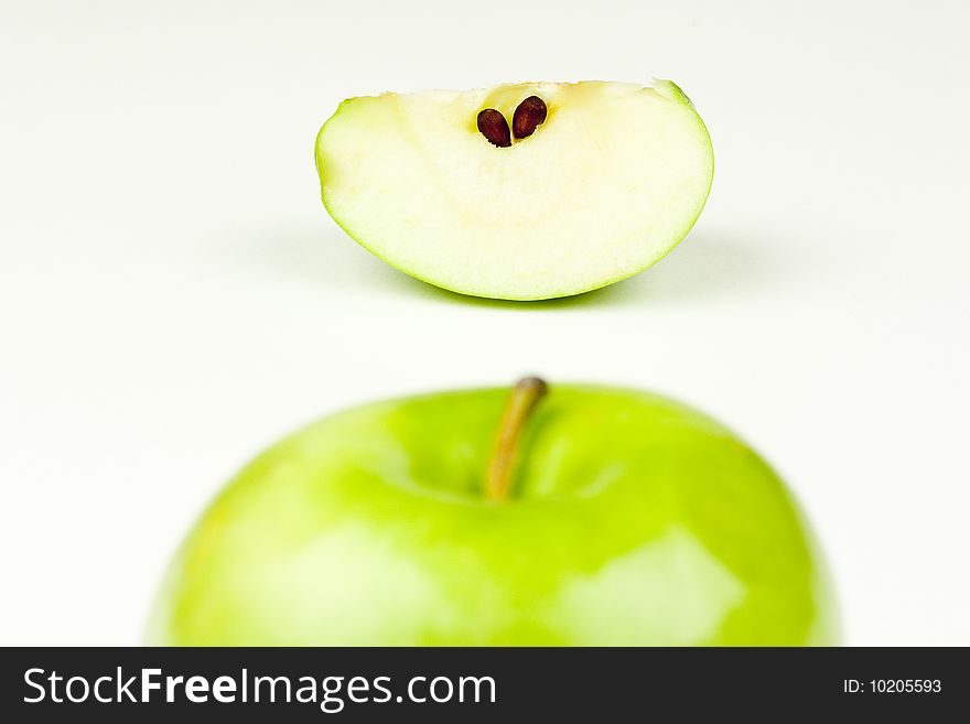 An apple top and apple slice. An apple top and apple slice