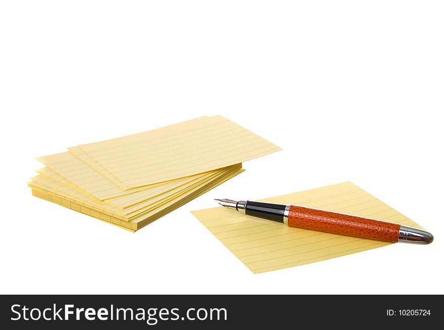 Notes block and pen isolated on a white background