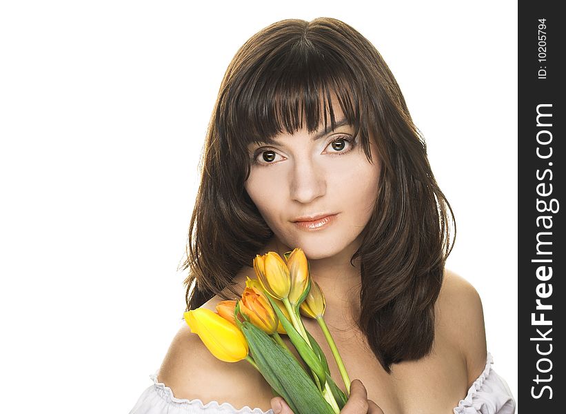 Portrait of pretty woman with yellow tulips