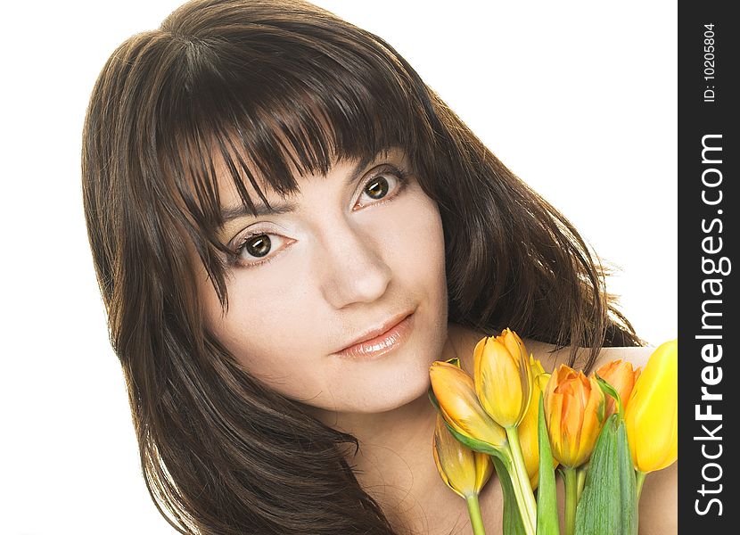 Portrait of pretty woman with yellow tulips