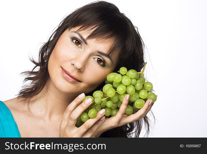 Portrait of young woman with green grapes. Portrait of young woman with green grapes