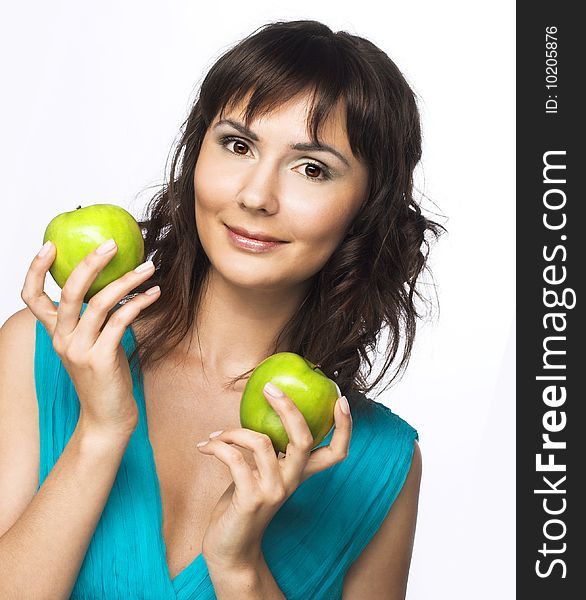 Portrait of young pretty woman with apple