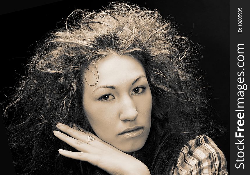 Romantic portrait of young woman wiht long curly hair