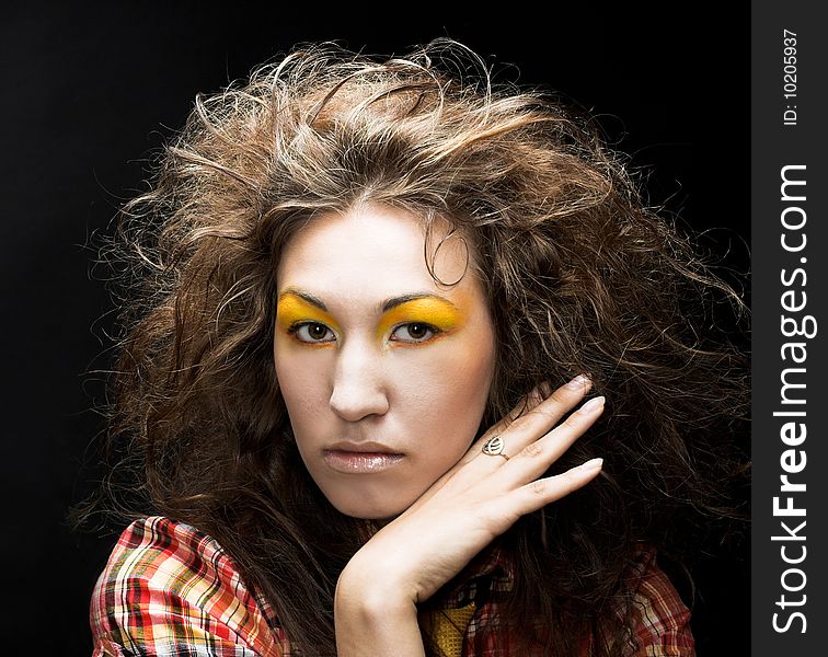 Romantic portrait of young woman wiht long curly hair