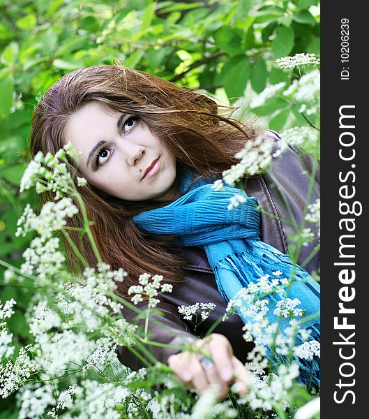 Portrait of young woman in blue scarf