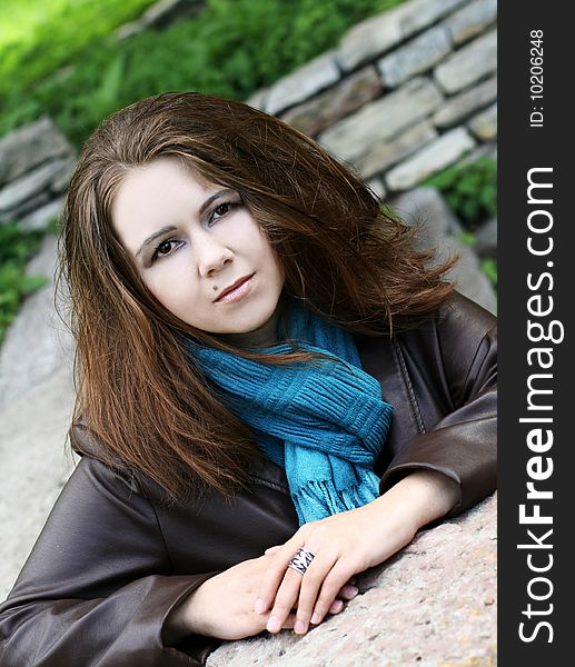 Portrait of young woman in blue scarf