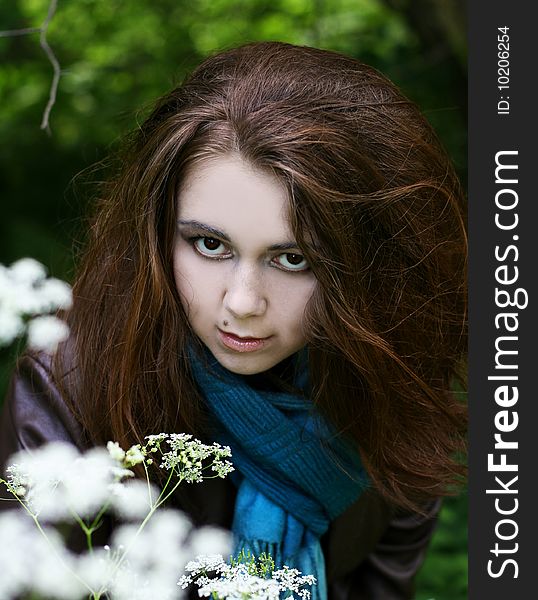 Portrait of young woman in blue scarf