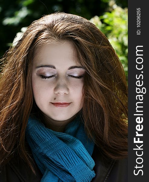 Portrait Of Young Woman In Blue Scarf