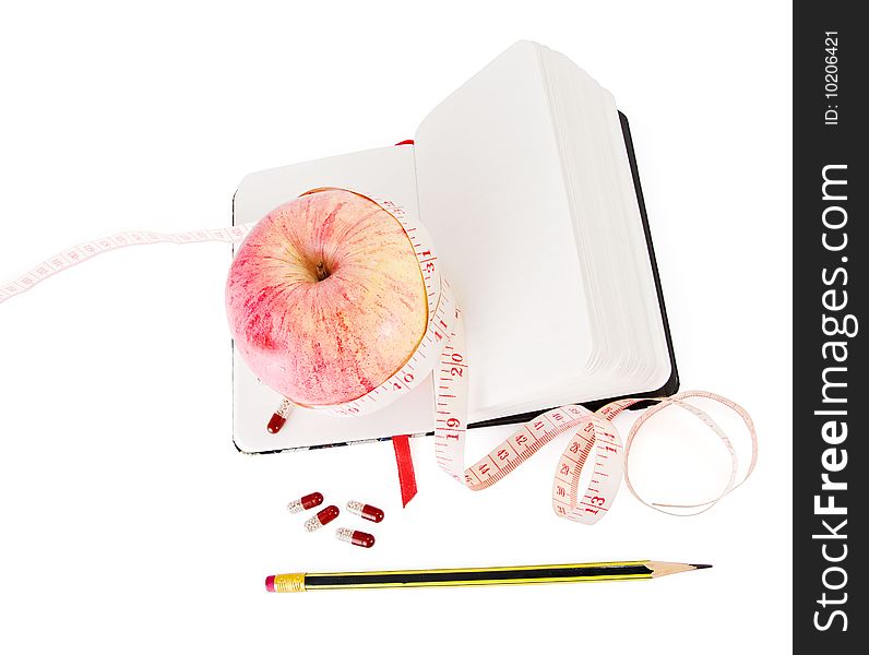 Diary With Apple And Pills For Effective Dieting