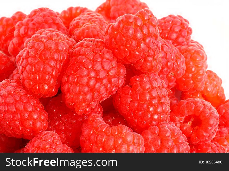 Fresh raspberries on white background