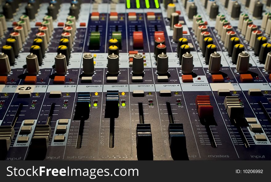 Sound producer mixer. Faders of channels and regulators. Close-up