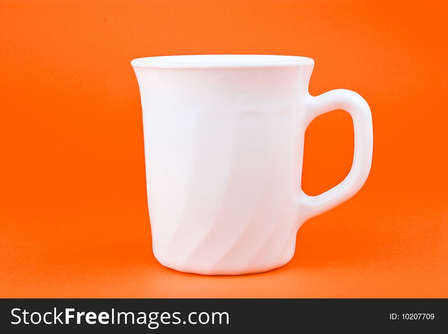 Your morning breakfast mug. Isolated on orange background