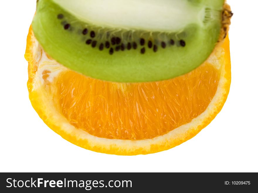 Fresh orange and kiwi isolated on white background. With focus on orange.