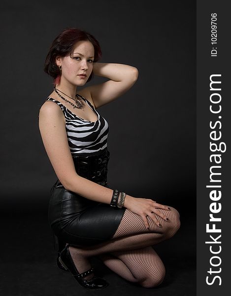 Young woman in leather skirt. Young woman in leather skirt