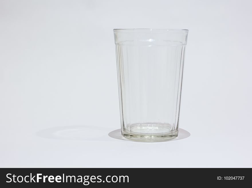 Faceted glass on white background isolated object. Faceted glass on white background isolated object