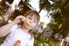 Little Gir Concentrated On Blowing Soap Bubbles Royalty Free Stock Images Little Gir Concentrated On Blowing Soap Bubbles Royalty Free Stock Images