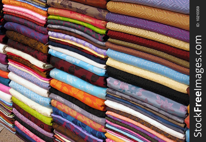 Colorful textiles with prints at a market. Colorful textiles with prints at a market