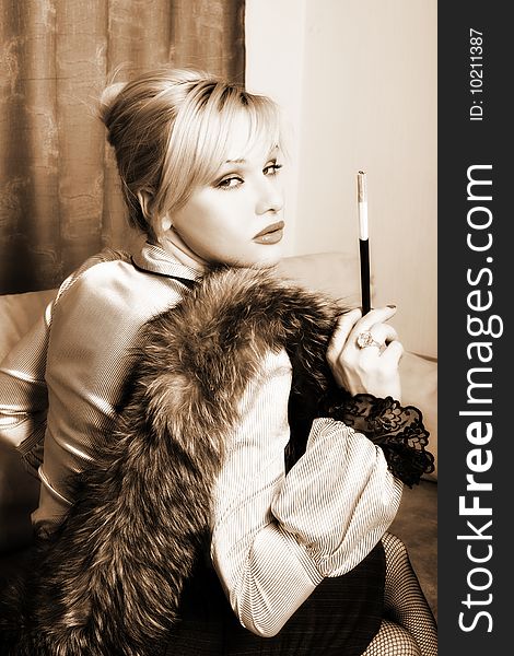 Girl in retro style with fur and cigarette