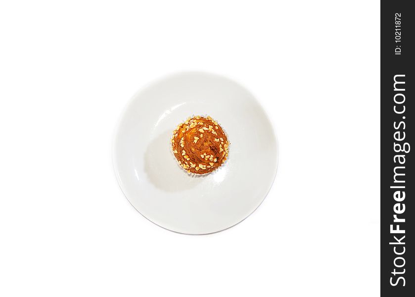 Isolated Peanut baked muffin on plate with white background. Isolated Peanut baked muffin on plate with white background