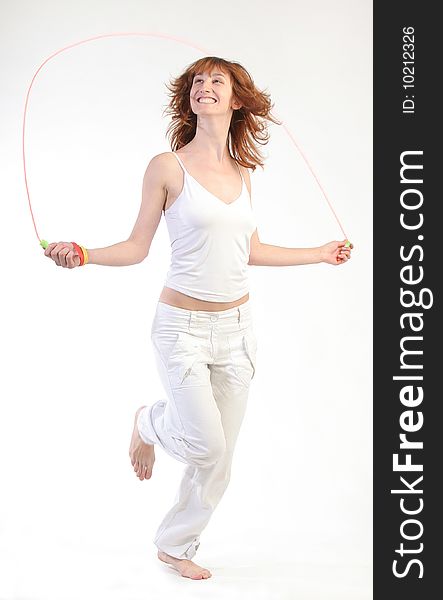 Girl jumping with skipping rope.