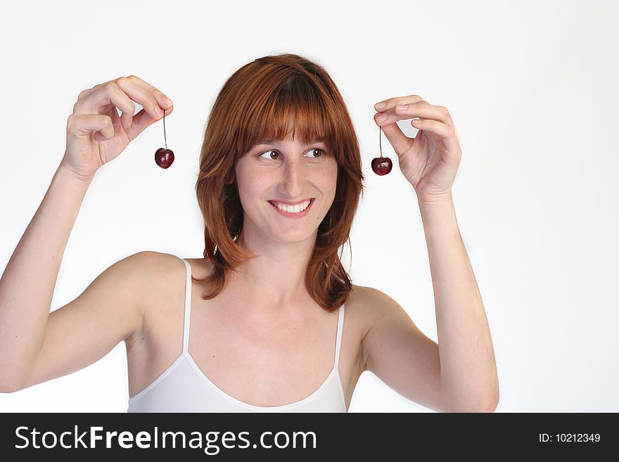 Pretty girl with cherries. Isolated