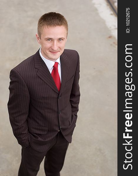 Portrait of a happy young businessman, smiling