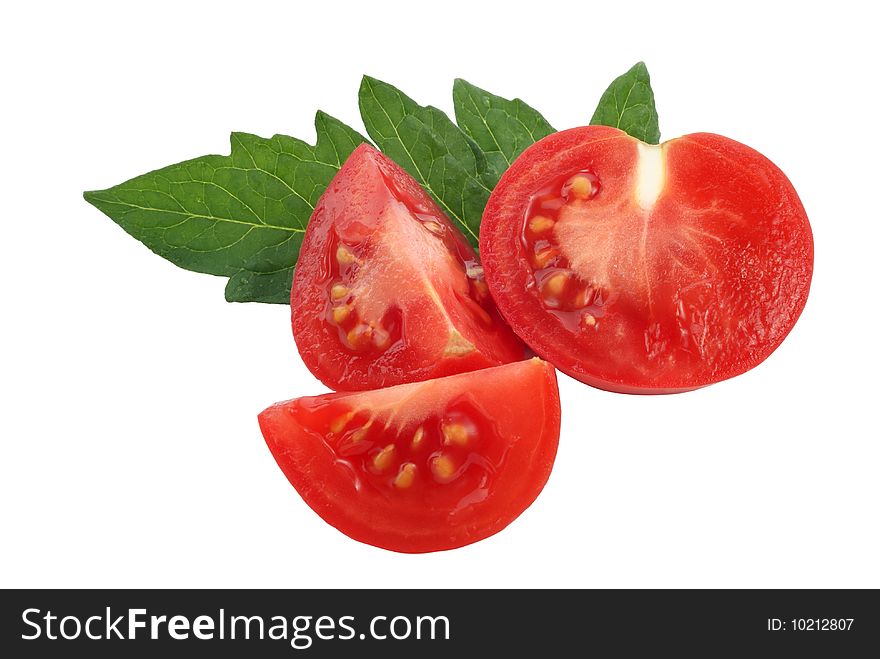Slices  of tomato and tomato leaf on white background. Slices  of tomato and tomato leaf on white background