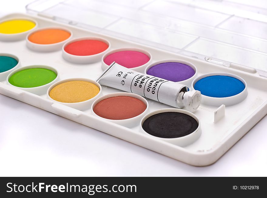 A box full of colorful gouache isolated on white