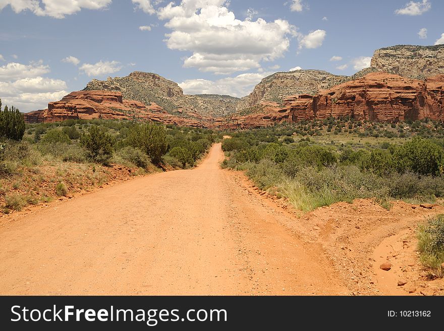 View of offroading desert in Sedona Arizona, red rocks surrounded by scrub brush