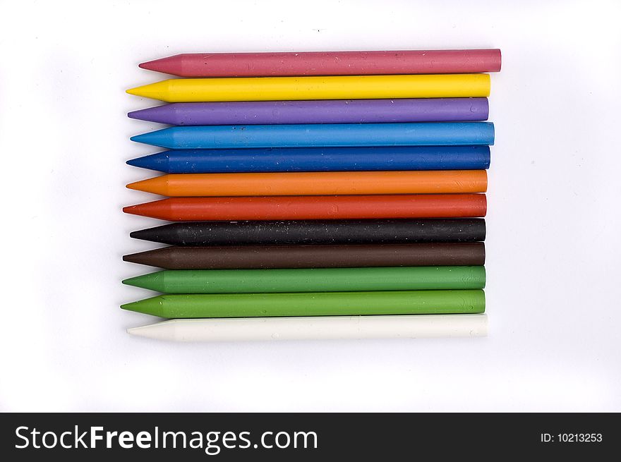 Arrangement of many colorful wax crayons