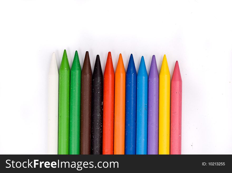 Arrangement of many colorful wax crayons