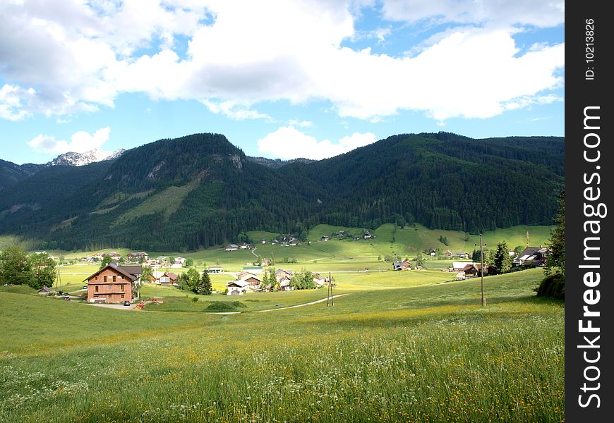 A beautiful village with green meadow. Shooting in Gosau village of Austria.