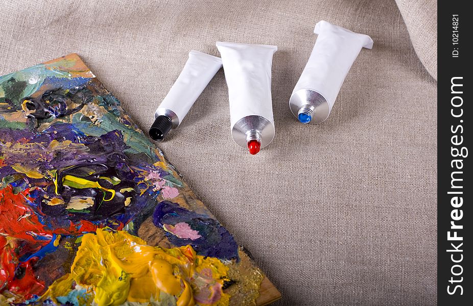 Paint tubes on linen canvas