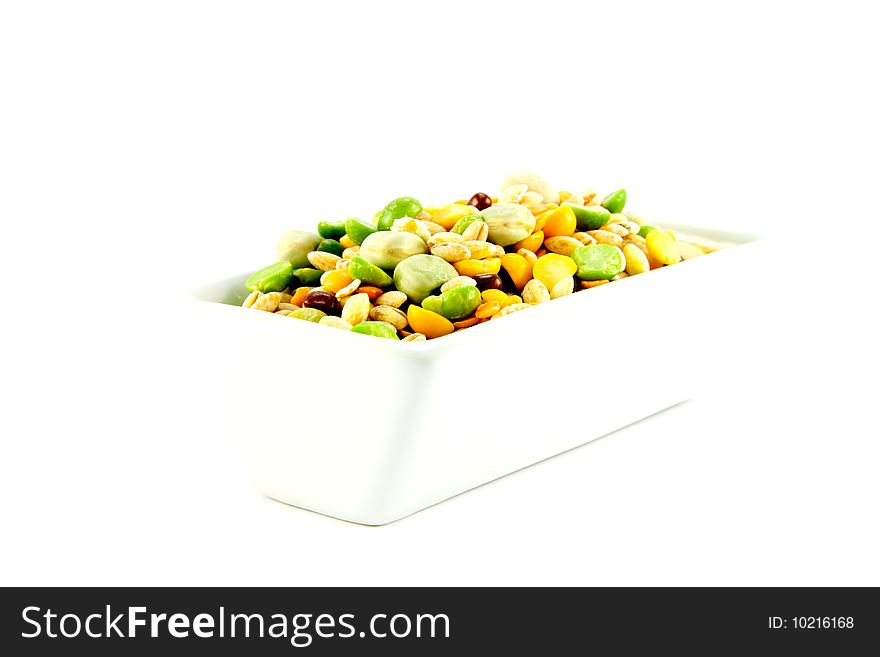 Assorted soup pulses in a dish with a white background