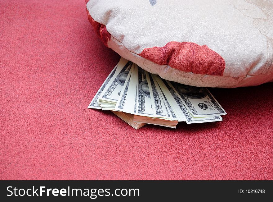 American dollars are stored under pillow. American dollars are stored under pillow