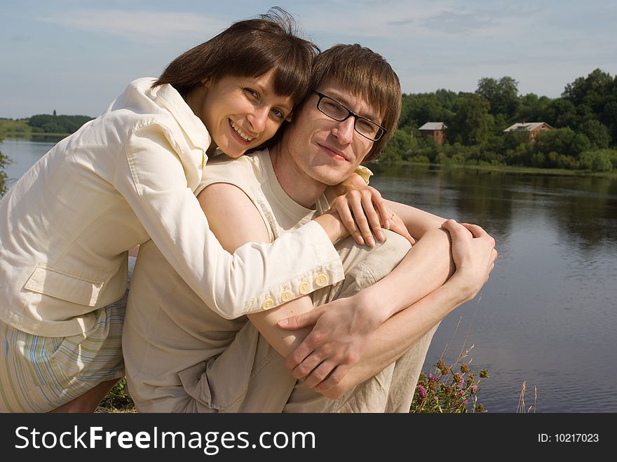 Boy And Girl On The River`s Bank