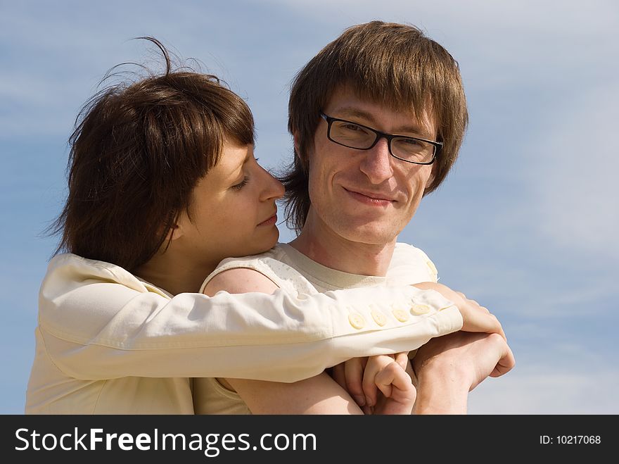 Boy and girl (couple) on the river`s bank. Boy and girl (couple) on the river`s bank