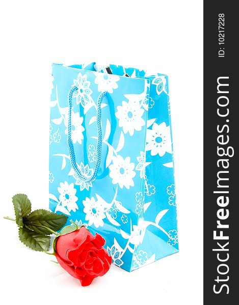 Empty paper shopping bag with handles with red rose isolated. Empty paper shopping bag with handles with red rose isolated