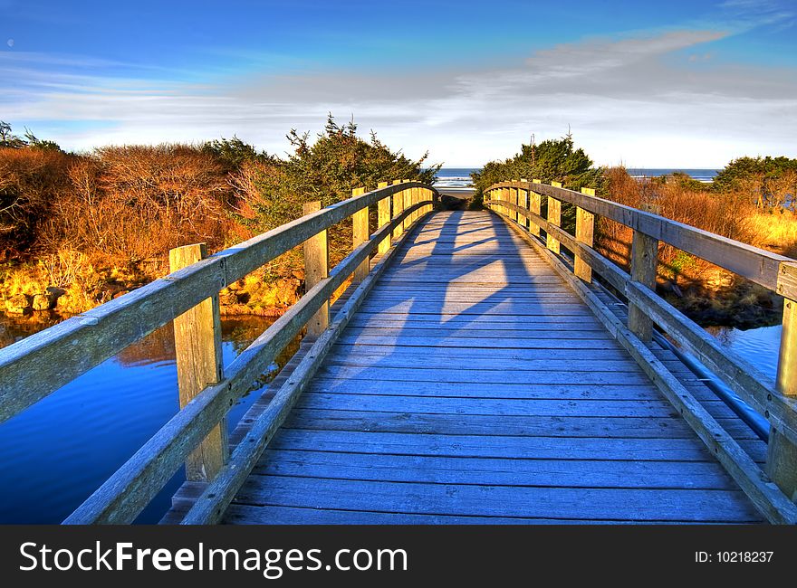 Bridge to the beach in winter morning