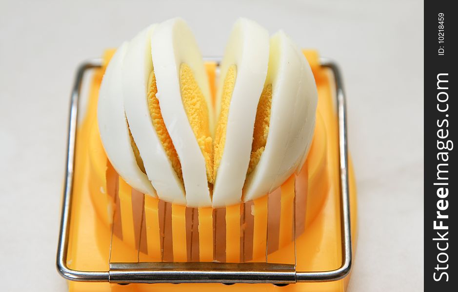 Cutting of boiled egg by egg cutter