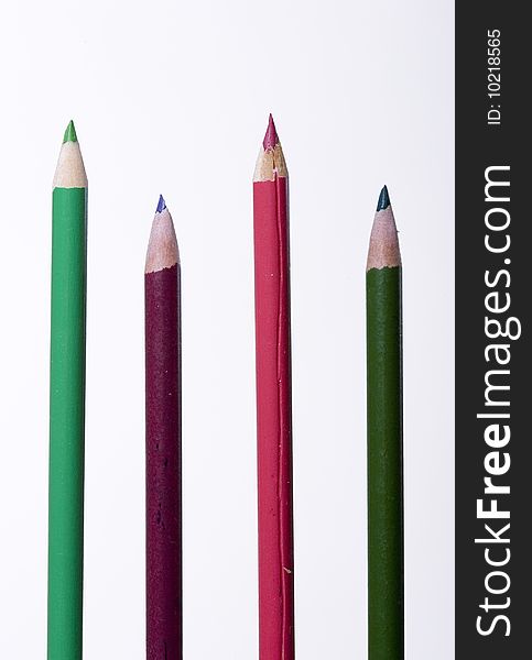 Four coloring pencils against a white background. Four coloring pencils against a white background.