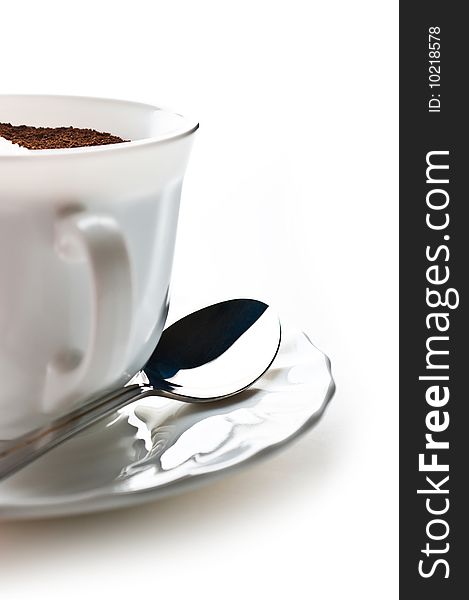 Cup full of coffee and sugar is isolated against a white background. Cup full of coffee and sugar is isolated against a white background