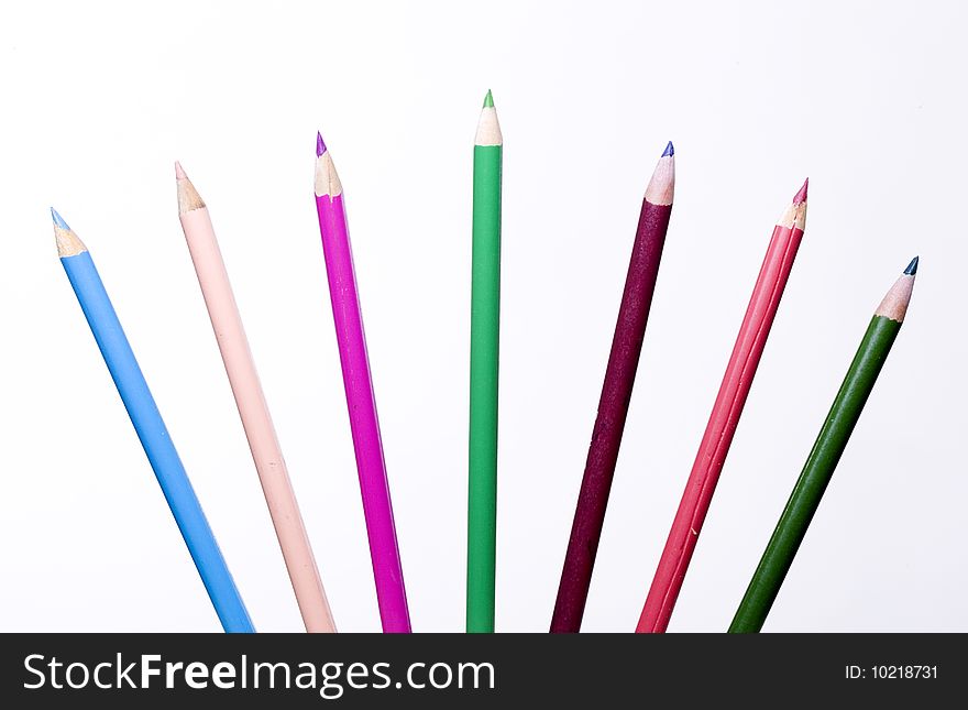 Coloring pencils fanned out against a white background. Coloring pencils fanned out against a white background.